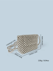 Macro detail of hand-woven silver metal beaded bag with size and weight dimensions