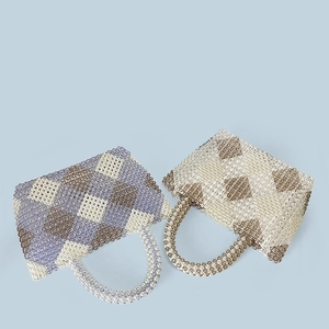 Close-up of handmade beaded tote bags featuring colorful diamond checkered weave patterns