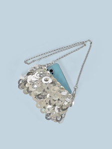 Silver sequin chain crossbody bag with metallic round discs and glossy reflective finish