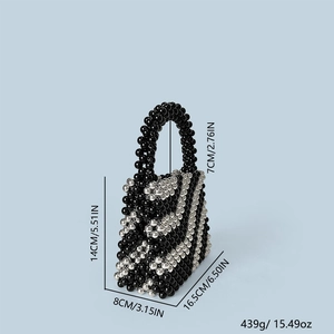 Detailed view of beaded bucket bag dimensions with black and silver striped weave