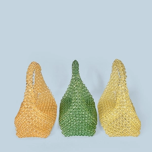 Detailed grid of handmade acrylic beaded tote bags in amber, green, and yellow colors