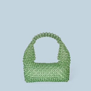 Detail of hand-woven green acrylic beaded tote bag with transparent crystal-like finish