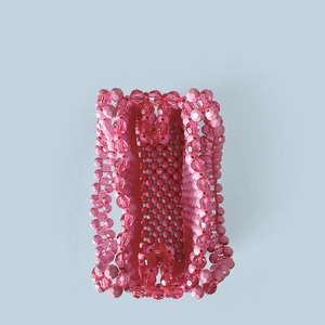 Top view of pink beaded handmade bag showing intricate weave and interior space