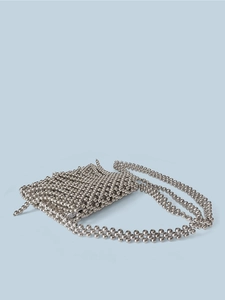 Detailed view of handmade woven metal bead mini square bag with shiny silver crossbody strap