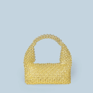 Close-up of lemon yellow acrylic beaded tote with handmade geometric woven pattern
