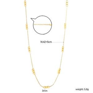 Detail of gold cube necklace showing clasp, adjustable extension chain, and measurements