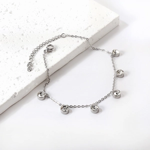 Silver stainless steel anklet featuring six round cubic zirconia charms on a delicate chain