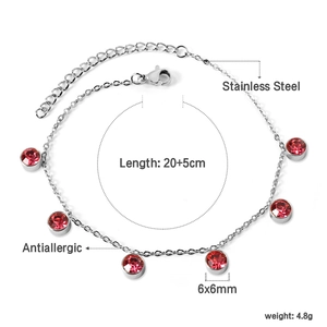 Detail of 18K gold plated stainless steel anklet with round red cubic zirconia stones