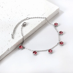Silver stainless steel anklet featuring red round crystals and adjustable lobster clasp