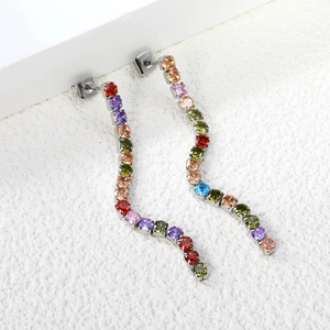 Detailed view of long S-shaped wavy earrings with vibrant multi-colored rhinestones