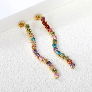 Detailed view of colorful zircon tassel earrings in wavy gold stainless steel setting
