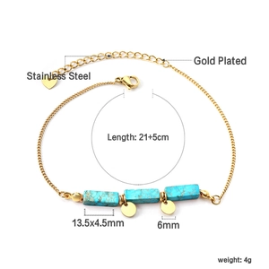 Detail of gold-plated stainless steel anklet with blue rectangular turquoise pendants