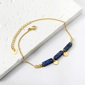 Vintage gold ankle bracelet with blue rectangular stones and small heart charm