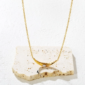 Minimalist gold necklace with a curved crescent moon pendant and white opal stone