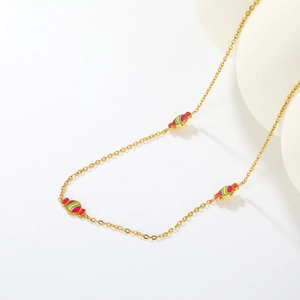 Minimalist gold-plated stainless steel necklace with striped enamel candy pendants