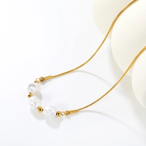 French vintage irregular pearl necklace with 18K gold plated snake chain on white background