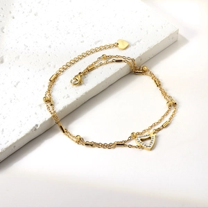 Double-layered gold stainless steel anklet with a zircon-paved hollow heart pendant