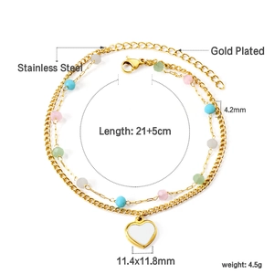 Detail of double-layer gold plated stainless steel anklet with colorful beads and heart charm