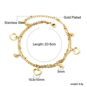 Detail of gold plated stainless steel double layer anklet with heart and bead charms