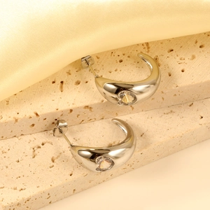Silver C-shape hoop earrings with heart cut white zircon on elegant stone display