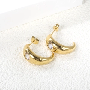 Golden C-shaped stainless steel earrings with sparkling round cubic zirconia inlay