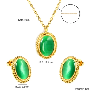 Macro detail of gold-plated necklace chain and green cat eye stone pendant dimensions