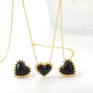 Vintage stainless steel heart jewelry set with black cat eye stone and golden beaded edges