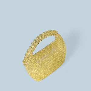 Detailed close-up of handmade yellow beaded tote bag with woven acrylic crystals