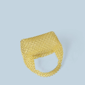 Detailed view of yellow handmade beaded tote bag with a woven crystal texture design