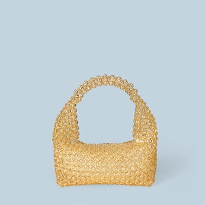 Close-up of handmade amber acrylic beaded tote bag with intricate woven texture and handle