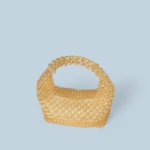 Detailed view of amber beaded tote bag with faceted resin beads and woven structure