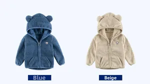 Detail of children's fleece hoodie with cute bear ears and embroidered logo patch
