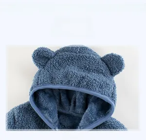 Detail shot of cozy blue teddy fleece kids hoodie with cute 3D bear ears on the hood