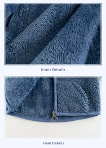 Detail of warm blue sherpa fleece lining and hem with round metal zipper puller