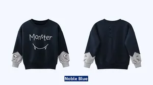 Detail view of noble blue kids monster sweatshirt with spine ridges and printed sleeves