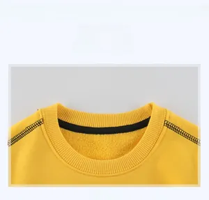 Close-up of yellow sweatshirt neckline featuring elastic ribbed knit and contrast stitching