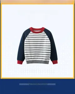 Detail of boys striped sweater featuring raglan sleeves and contrast navy blue cuffs