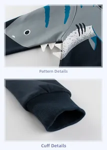 Detail view of boys fleece hoodie featuring shark pattern with 3D fabric teeth and ribbed cuffs