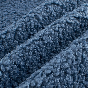 Close-up of soft blue sherpa fleece fabric texture for children spring warm jacket