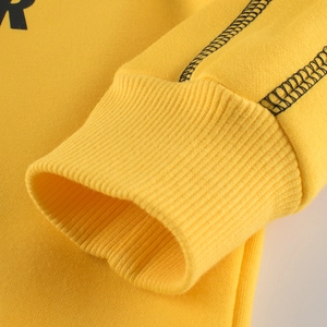 Bright yellow long sleeve sweatshirt for boys featuring black stitching and ribbed cuffs