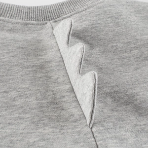 Heather gray children's sweatshirt featuring a 3D dinosaur fin detail on the neckline