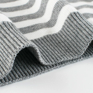 Classic grey and white striped knit sweater for boys with ribbed cuffs and soft texture