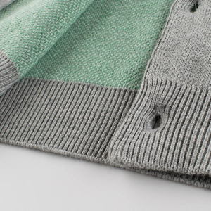 Green and grey knit boy's sweater featuring detailed jacquard pattern and ribbed hem