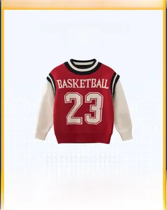 Detail of boys' knit sweater with red basketball print and varsity striped sleeve cuffs