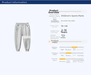 Detail view of grey cotton jogger pants for kids with side stripes and ribbed cuffs