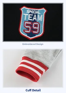 Detail of embroidered shield patch and striped ribbed cuffs on boys' fleece hoodie