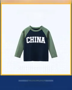 Close-up of boys' cotton long sleeve T-shirt with CHINA print and raglan sleeve detail