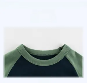 Detail of ribbed crew neck on boys' raglan sleeve T-shirt with high-quality stitching