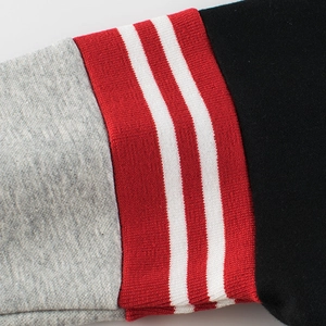 Boys hooded sweatshirt with grey knit cuffs and red ribbed stripes on black fabric
