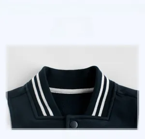 Detail view of navy baseball jacket collar with striped ribbing and snap buttons